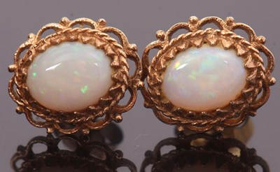 Lot 174 - A pair of opal earrings, the oval opal...