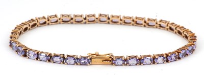Lot 181 - A 9ct tanzanite bracelet, set throughout with...