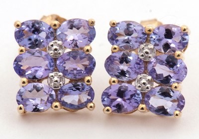 Lot 160 - A pair of tanzanite earrings, each set with...