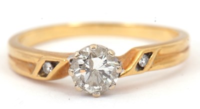 Lot 87 - An 18ct diamond ring, with a central round...