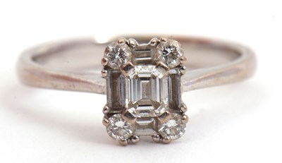 Lot 81 - A diamond cluster ring, set with emerald,...