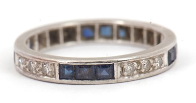 Lot 93 - A platinum sapphire and diamond eternity ring,...