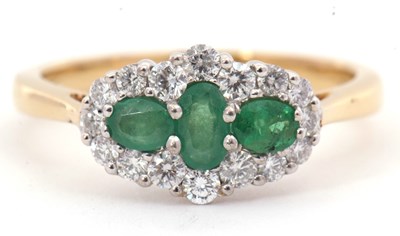 Lot 80 - An emerald and diamond ring, set with three...