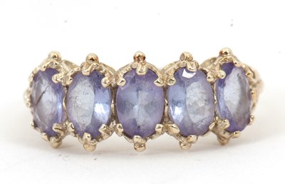 Lot 90 - A 9ct tanzanite ring, with five oval...