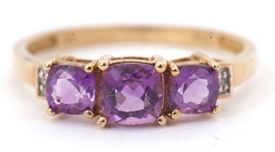 Lot 111 - A 9ct amethyst and diamond ring, set with...