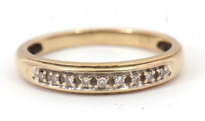 Lot 74 - A 9ct diamond half eternity ring, set with...
