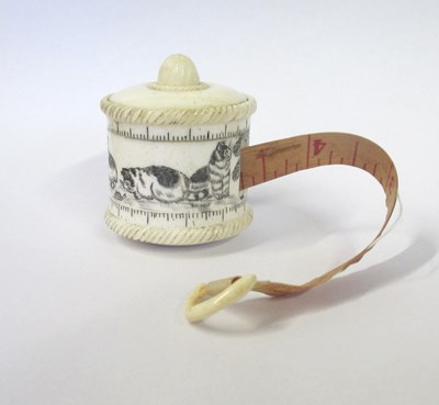 Lot 120 - A carved and turned bone tape measure, of drum...
