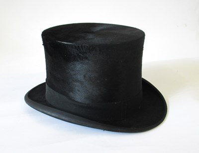 Lot 140 - A black silk top hat by Lincoln & Bennett & Co,...