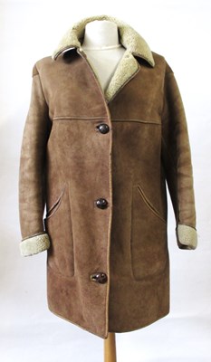 Lot 680 - A Nurseys sheepskin coat, with leather buttons,...