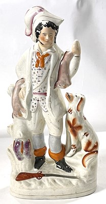 Lot 248 - A 19th Century Staffordshire figure of a...
