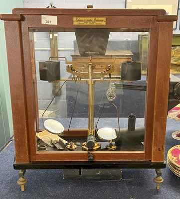 Lot 302 - A cased set of scales and weights with...