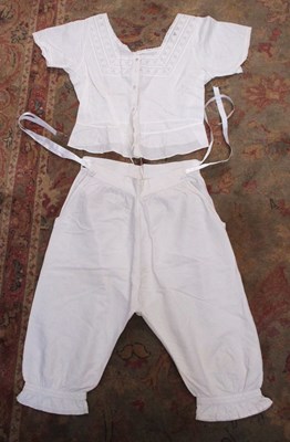 Lot 116 - A pair of cotton drawers (with later satin...