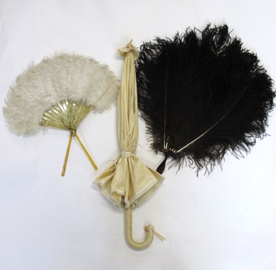 Lot 106 - Two ostrich feather fans and a modern cream...