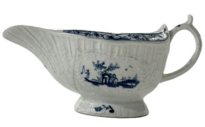 Lot 274 - A Lowestoft porcelain sauce boat, the moulded...