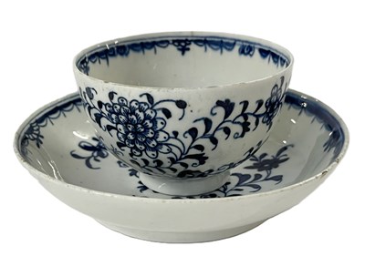 Lot 318 - A Lowestoft porcelain tea bowl and saucer...
