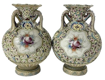 Lot 310 - A continental pair of vases with applied...