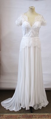 Lot 27 - A wedding gown, with lace bodie with cap...