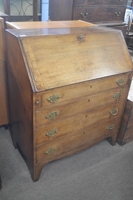 Lot 441 - A late Georgian oak bureau of typical form...