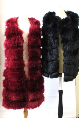 Lot 62 - Two faux fur gilets, including one in red by...