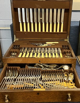 Lot 267 - An early 20th Century oak cutlery canteen...