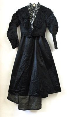 Lot 3 - A Victorian black mourning jacket and skirt,...