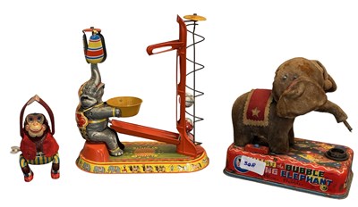Lot 334 - A collection of tinplate clockwork toys (AF)