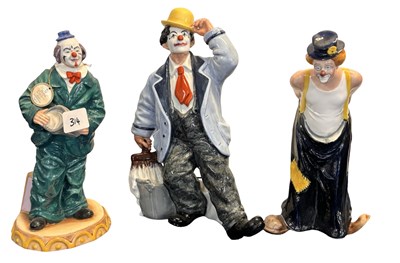 Lot 340 - A group of three Royal Doulton clown figures,...