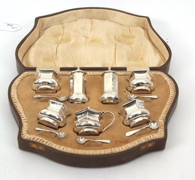 Lot 112 - A cased George V seven piece silver condiment...
