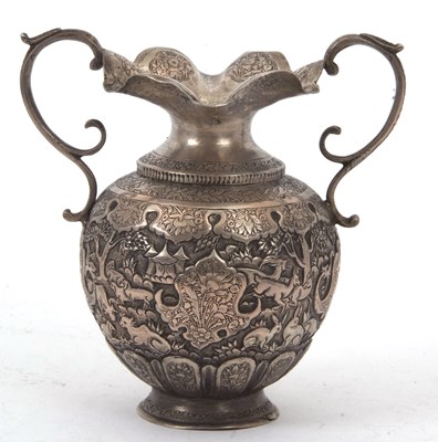 Lot 130 - An Indian metal twin handled baluster vase,...
