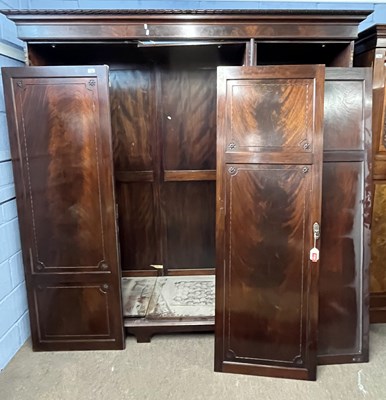 Lot 462 - An Edwardian mahogany triple wardrobe with...
