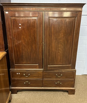 Lot 465 - A small Georgian mahogany linen press with a...
