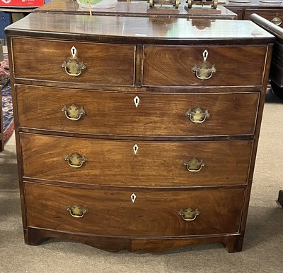 Lot 415 - A late Georgian mahogany chest of two short...