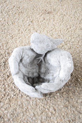 Lot 24d - Composite bird feeder in the shape of hands