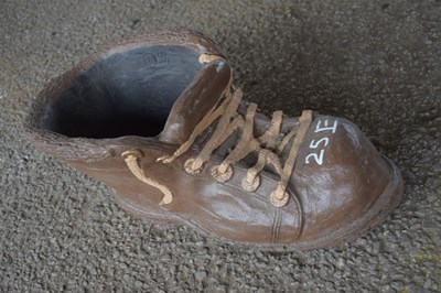 Lot 25e - Composite garden ornament formed as a shoe,...