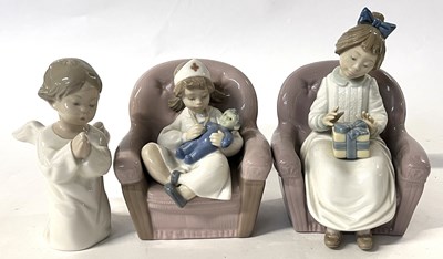 Lot 355 - A Nao figure of a young girl in nurses uniform...
