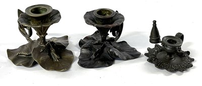 Lot 364 - Group of three chamber sticks on leafy bases,...