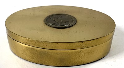 Lot 342 - An oval brass box and cover, the cover inlaid...