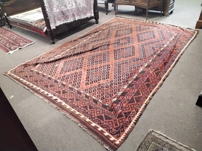 Lot 568 - A 20th Century Afghan Kelim rug with geometric...