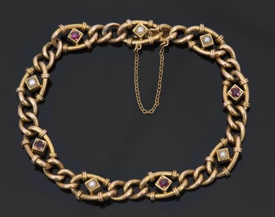 Lot 413 - A 15ct ruby and pearl bracelet, the curblink...