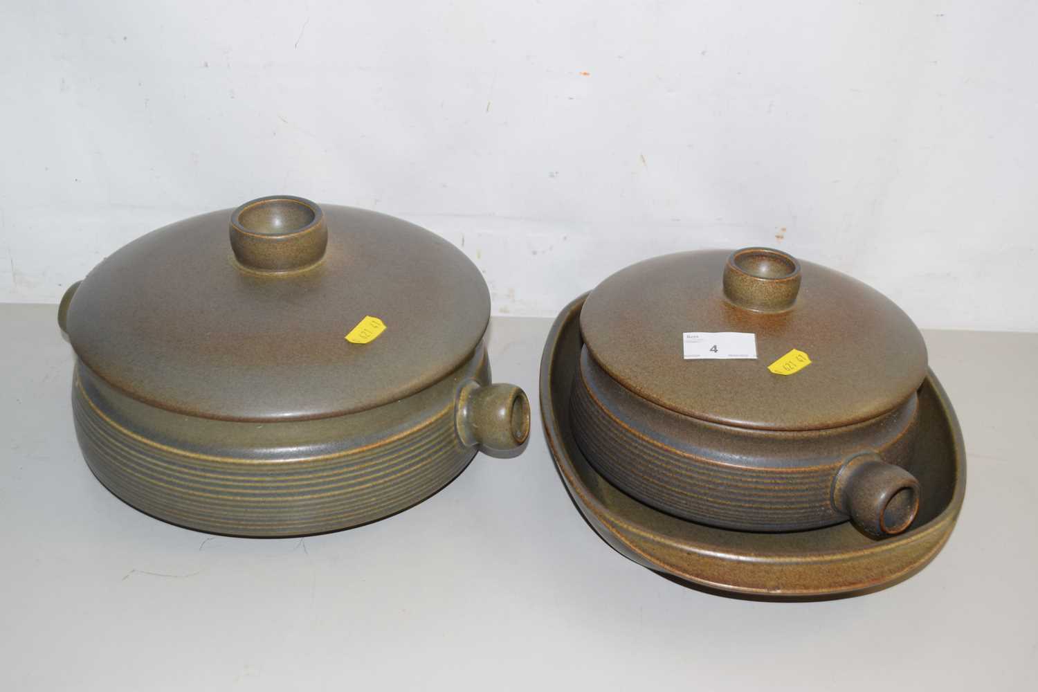 Lot 4 - Two pottery casserole dishes and a similar...