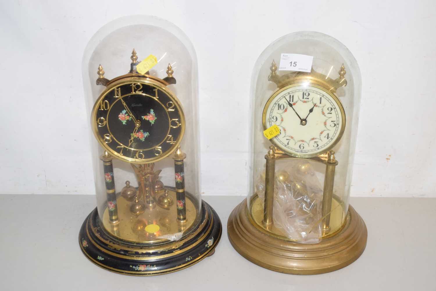 Lot 15 - Two anniversary clocks under domes