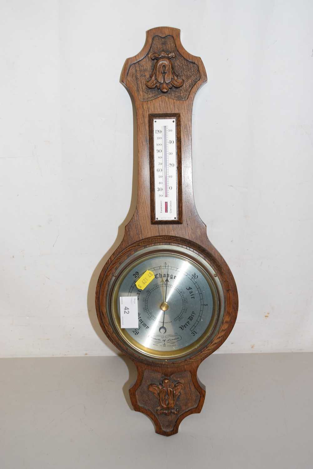 Lot 42 - A modern oak barometer by Comitti of London