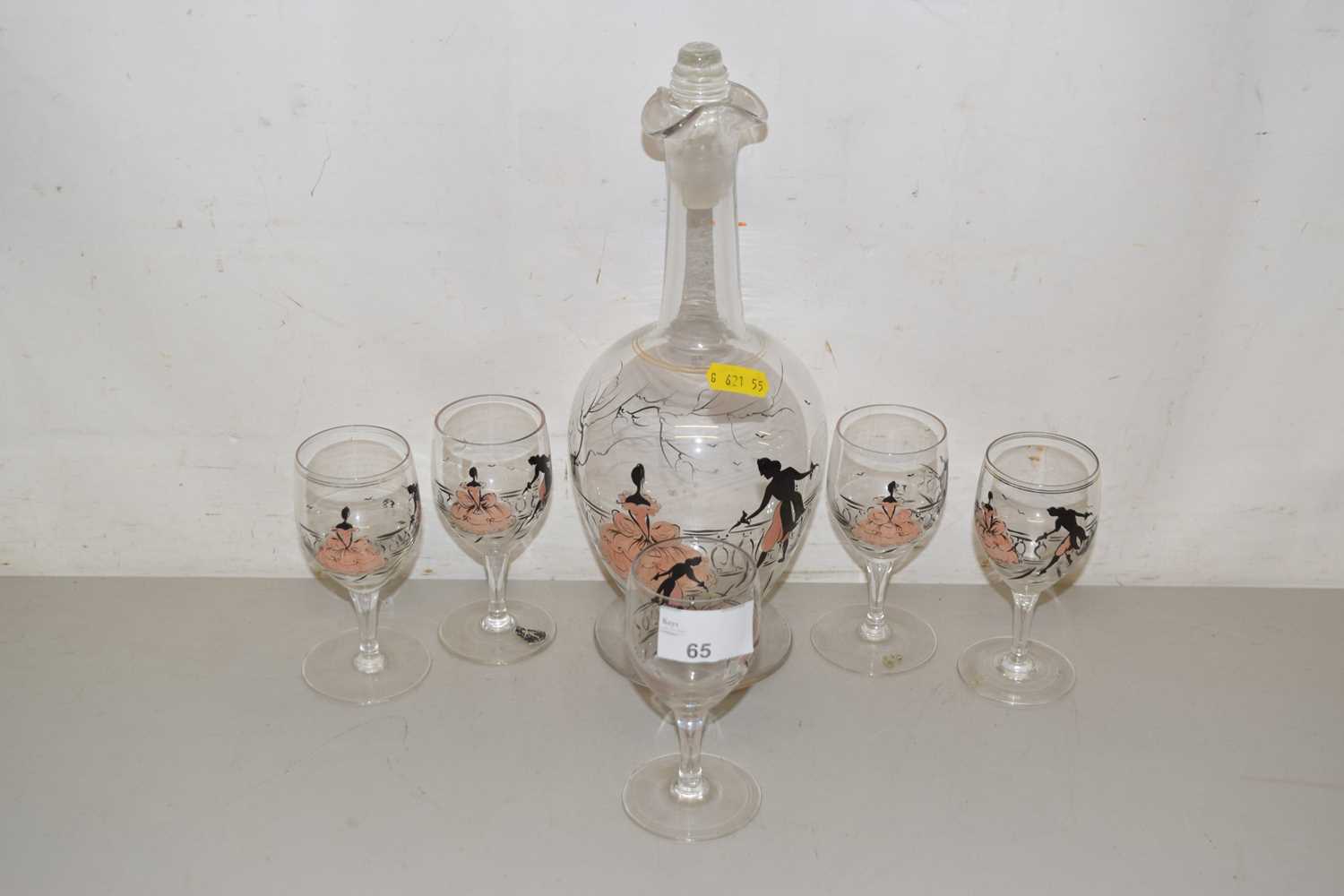 Lot 65 - A vintage decanter and glasses, patterned with...
