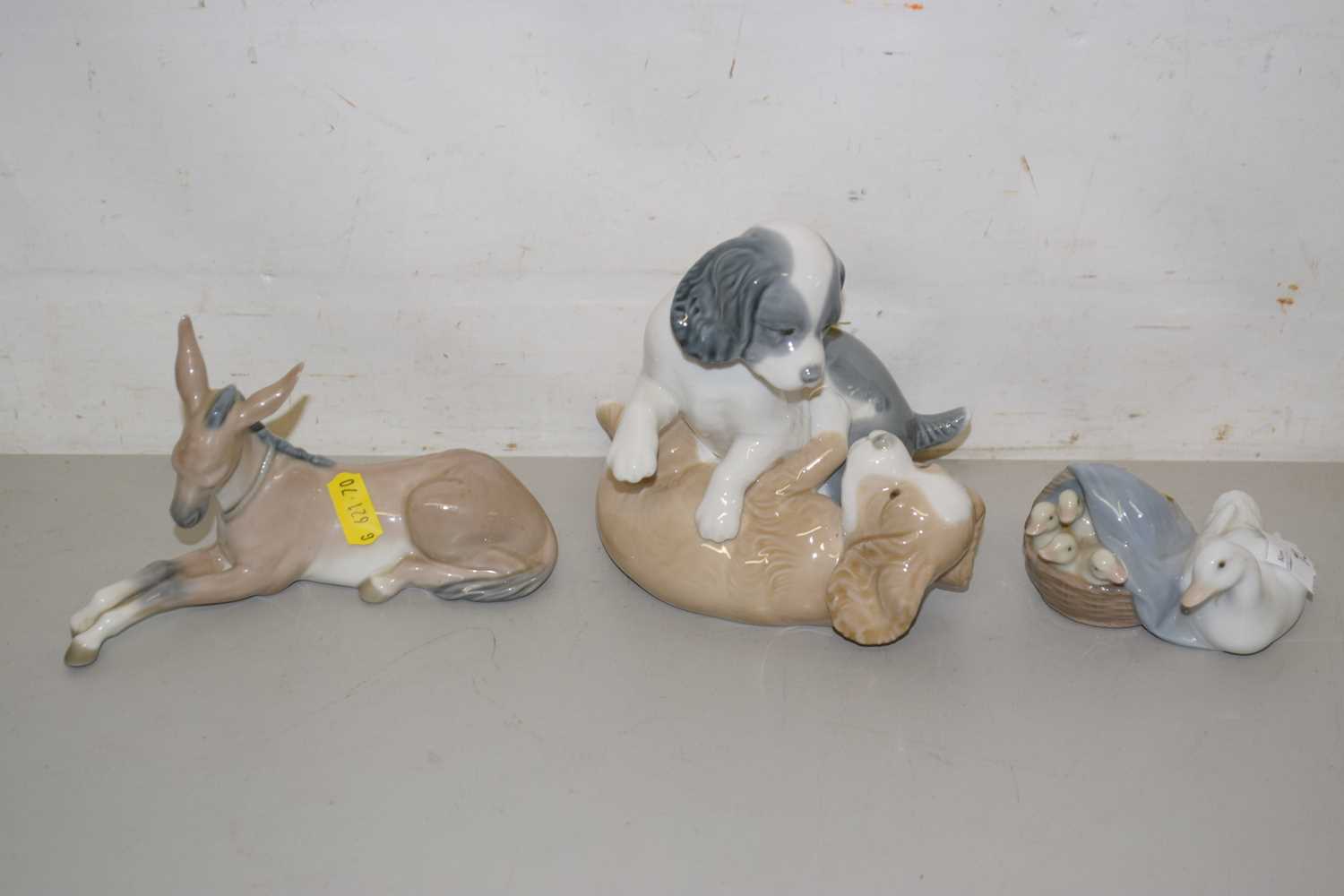Lot 73 - A Lladro donkey, Lladro ducks and Nao puppy...