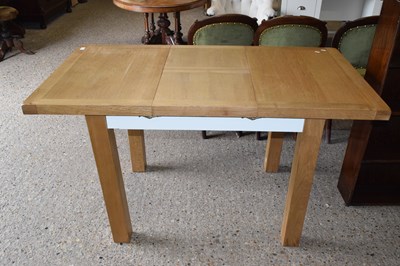 Lot 305 - A modern light oak dining table