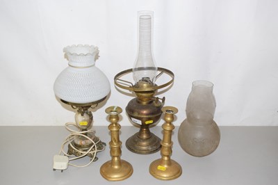 Lot 522 - An oil lamp, another converted for electricity...