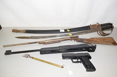 Lot 606 - Replica weaponry to include swords and an air...