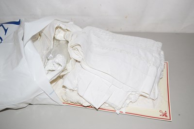 Lot 614 - A bag of assorted table cloths, linens and...