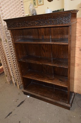 Lot 828 - A dark oak open front bookcase