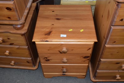 Lot 844 - Pine three drawer bedside cabinet